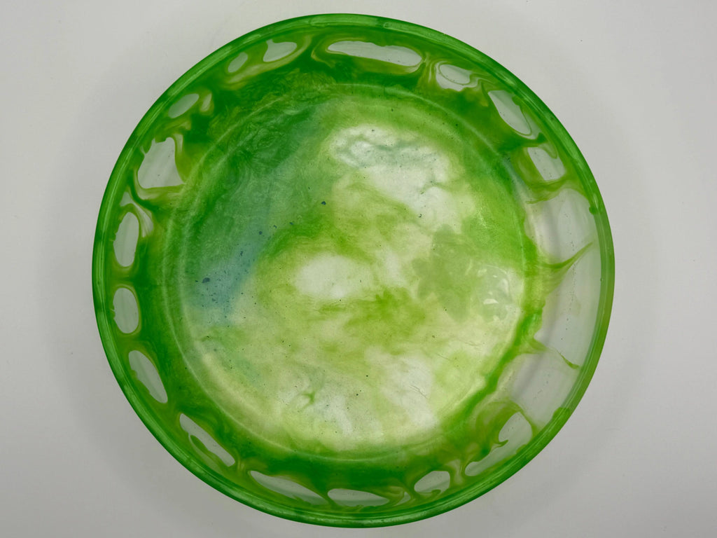 Green resin bowl with decorative on a white background