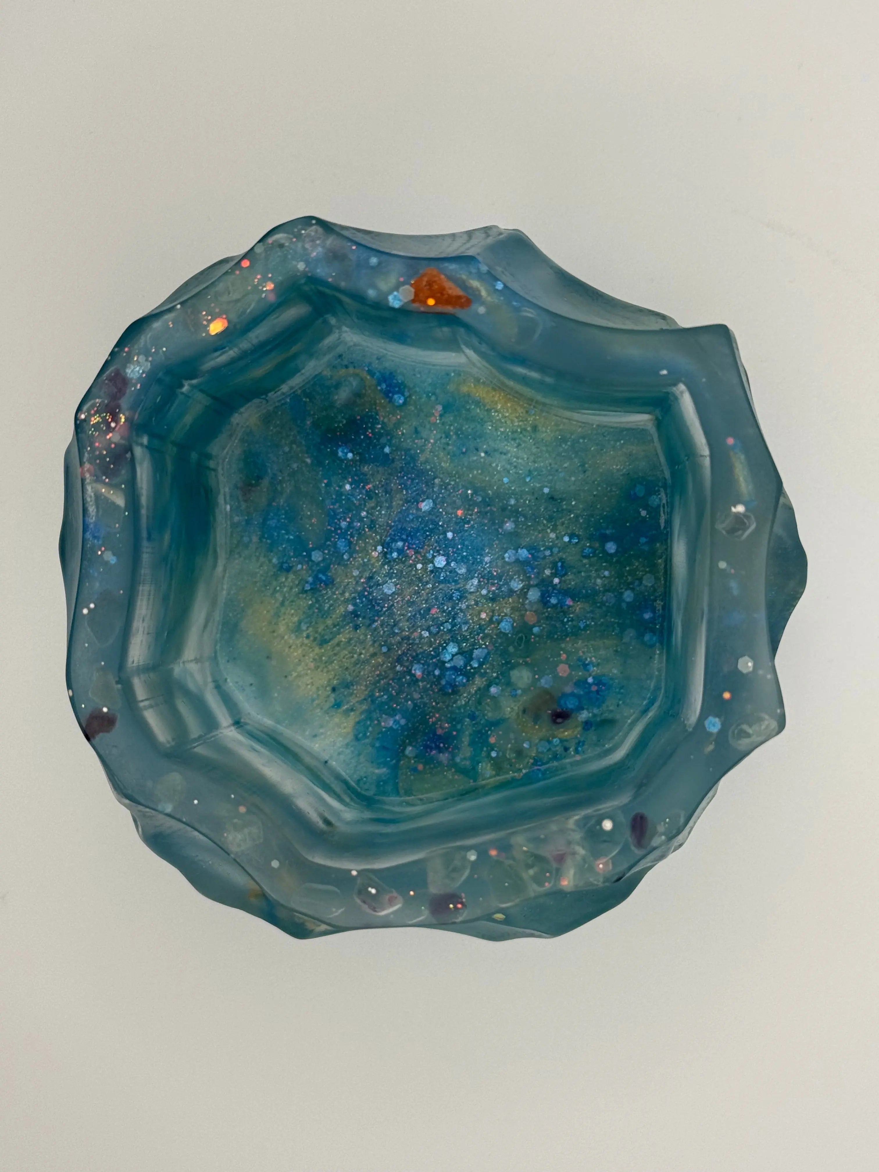 Octagon resin vase with a textured surface on a light gray background