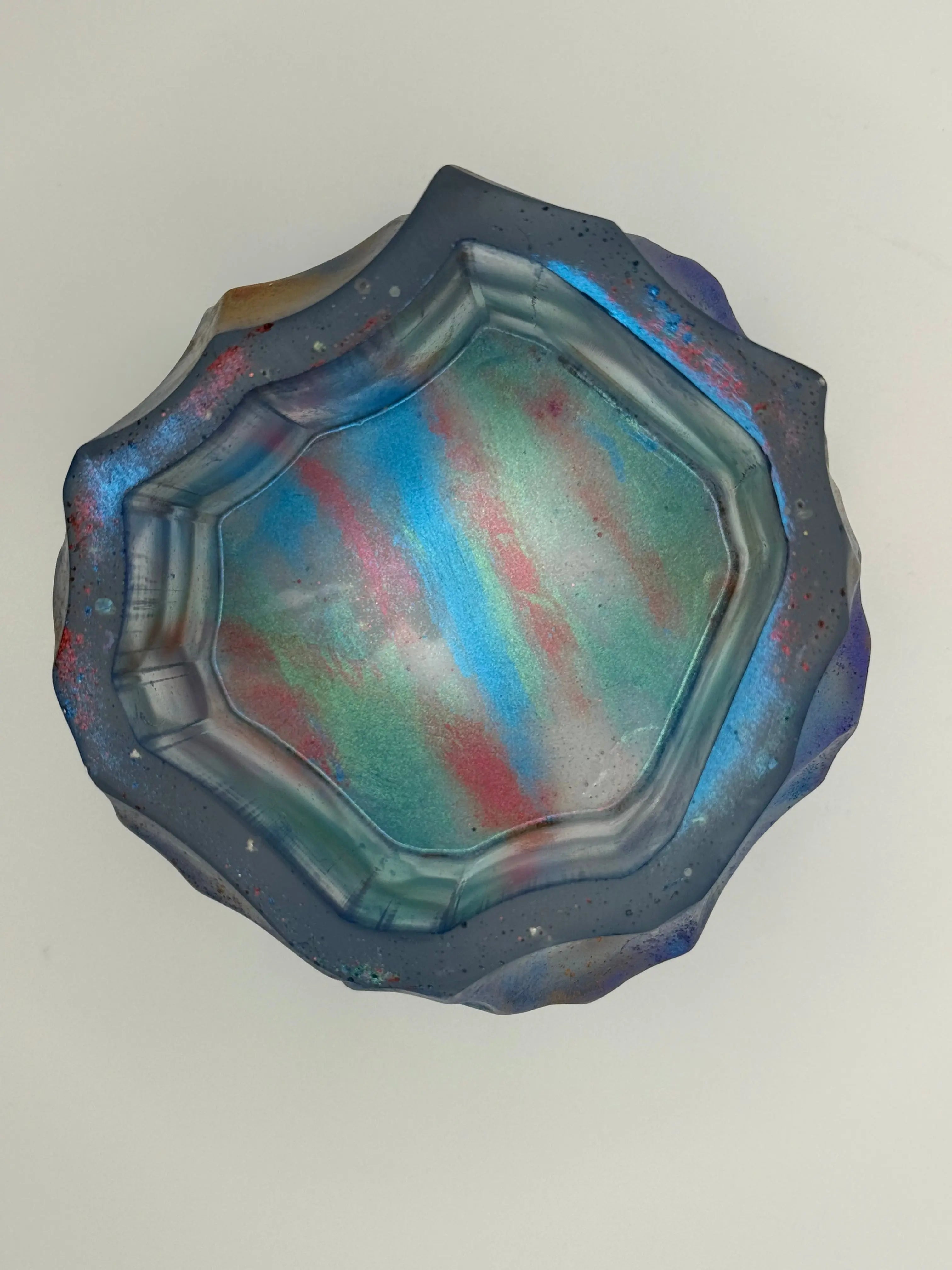 Decorative vase with multicolored pattern on a plain background
