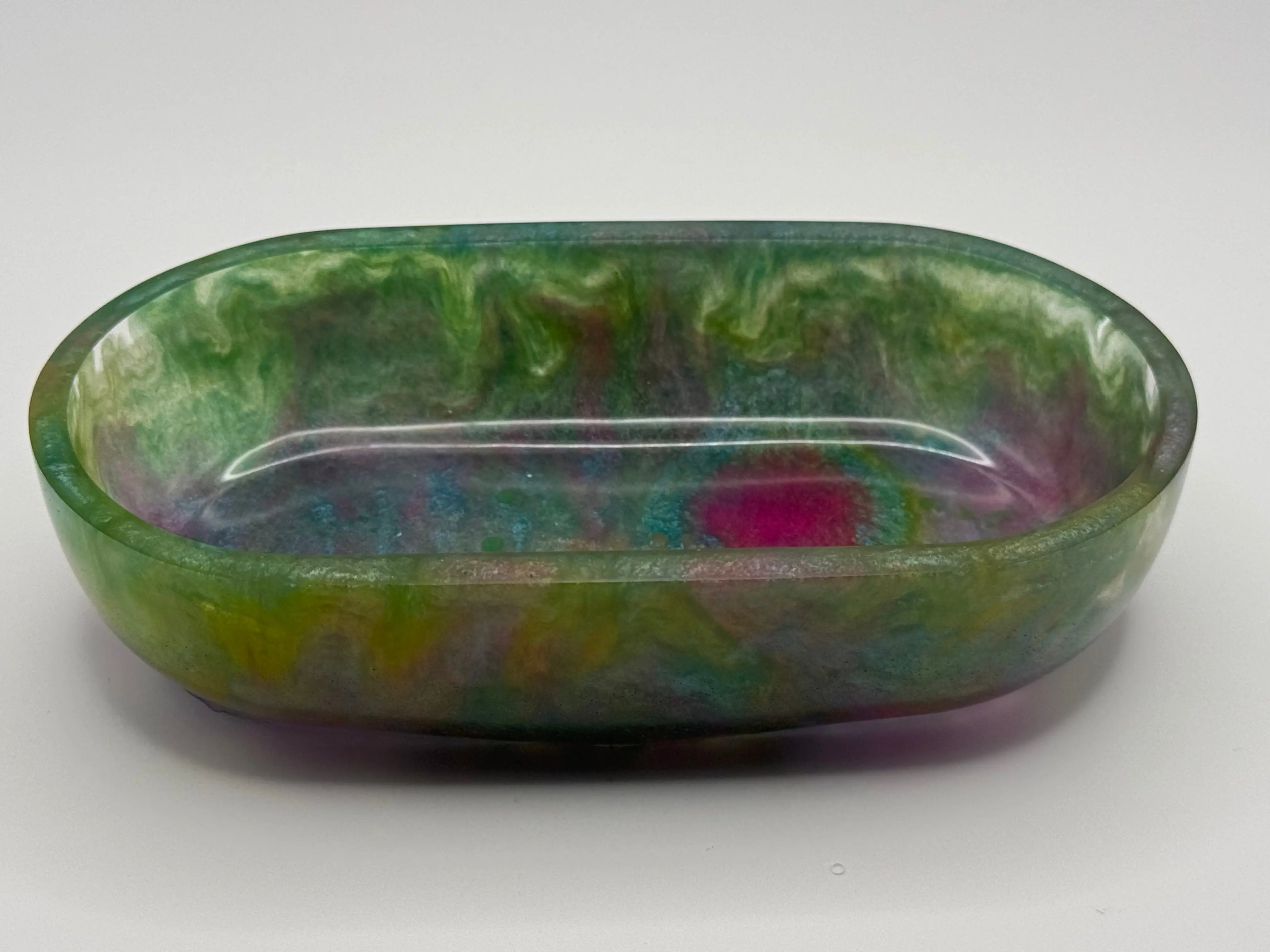 Multicolored resin dish on a white background