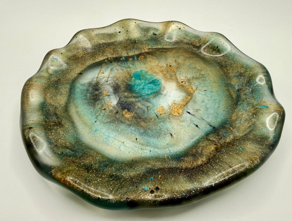 arthy jeweled-toned resin free-form plate with organic design on a white background
